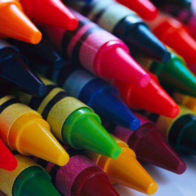 A bunch of crayons are stacked on top of each other
