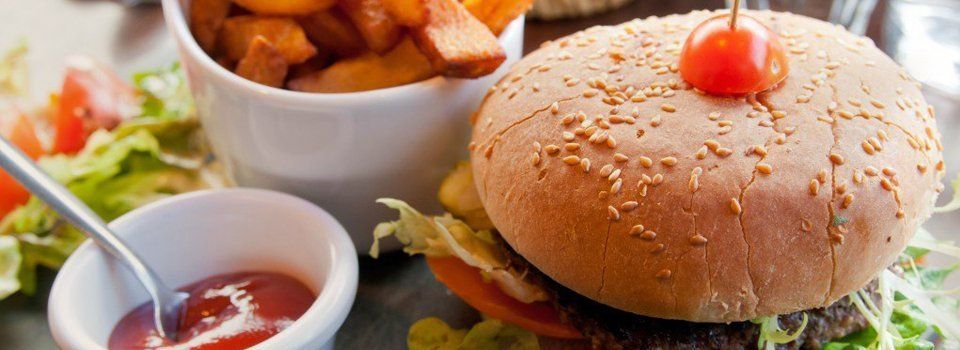 burger served with fries and sauce