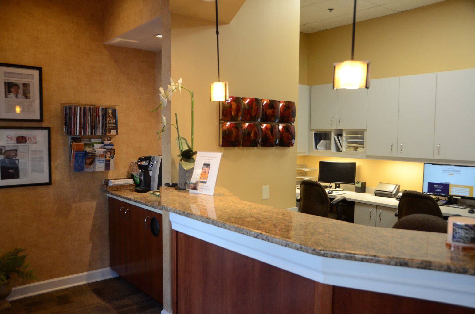 A dental office with a counter and chairs