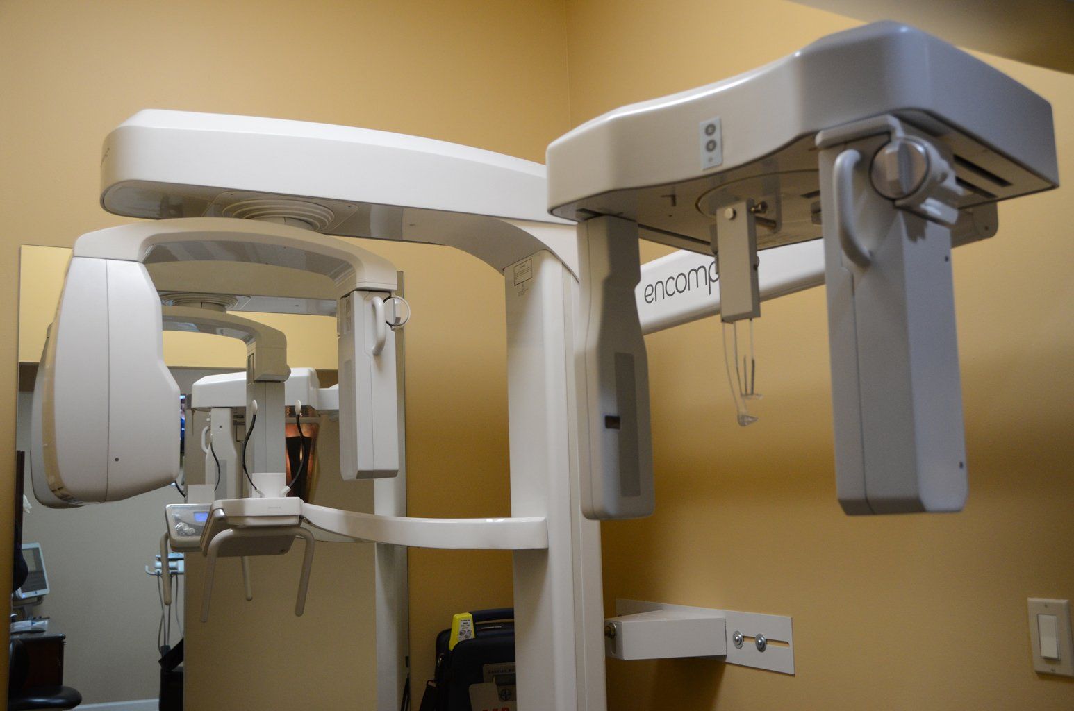 Two dental x-rays are sitting next to each other in a room.