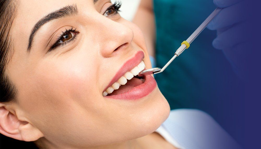 Woman getting teeth cleaned