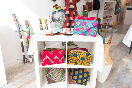 a shelf with a bunch of colorful bags on it