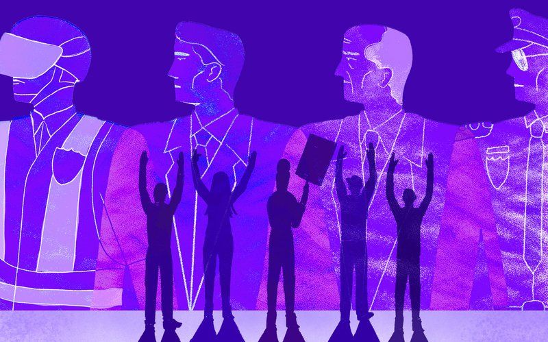 a group of people standing in front of a purple background