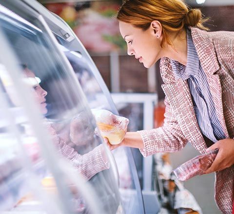 Woman Buying Frozen Goods — Sutherlin, VA — Elite Refrigeration Services, LLC. Woman Buying Frozen Goods — Sutherlin, VA — Elite Refrigeration Services, LLC.