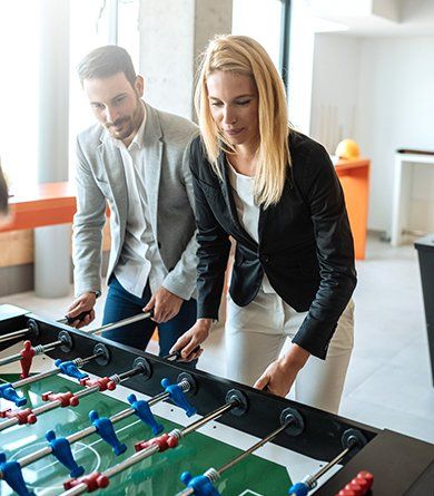Business People Playing Foosball — Waite Park, MN — Total Recreation Business People Playing Foosball — Waite Park, MN — Total Recreation
