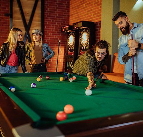 Group of Friends Playing Pool Table — Waite Park, MN — Total Recreation Group of Friends Playing Pool Table — Waite Park, MN — Total Recreation