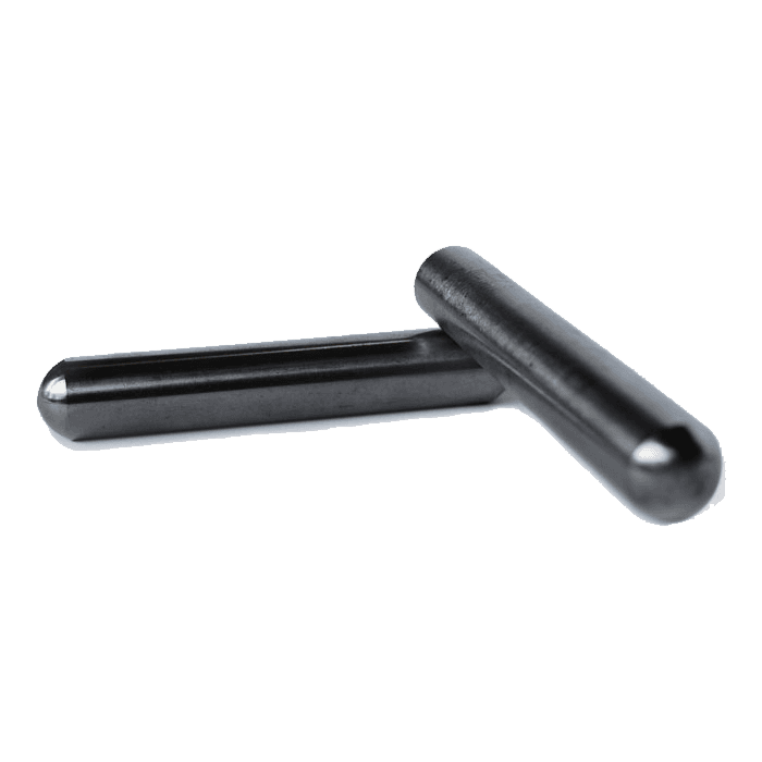 A pair of black pins are sitting next to each other on a white surface.