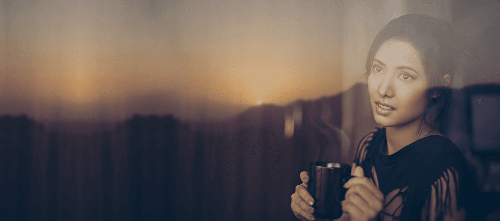 a lady holding the coffee