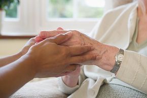 care taker holding hands
