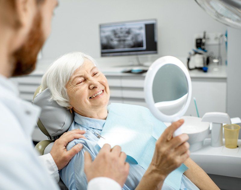 Old Lady Smiling With Dentures — Bismarck, ND — A Lifetime of Smiles Old Lady Smiling With Dentures — Bismarck, ND — A Lifetime of Smiles