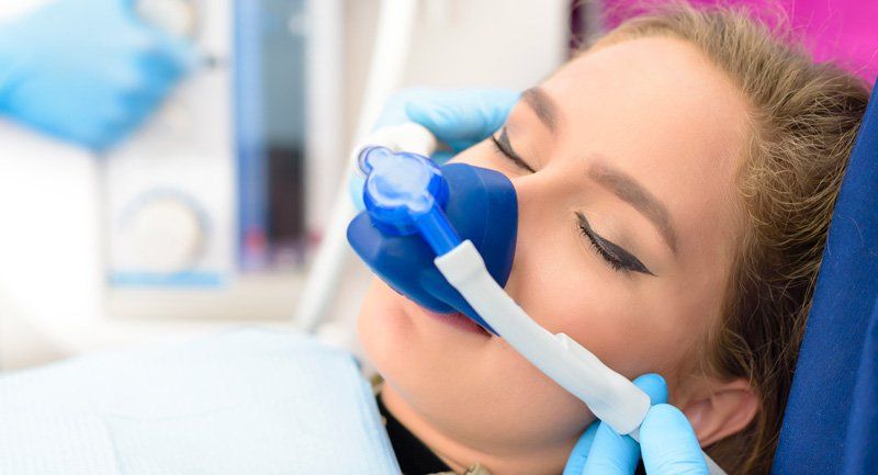 Woman During Sedation Dental Treatment — Bismarck, ND — A Lifetime of Smiles
