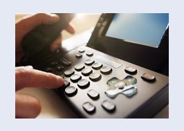 Person dialling number on the phone