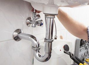 Plumber Fixing a Sink - Plumbing Contractor in Lakeland, FL Plumber Fixing a Sink - Plumbing Contractor in Lakeland, FL
