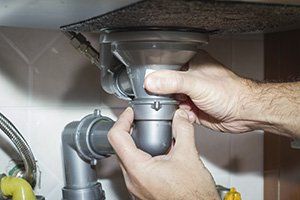 Plumber Fixing Drain Pipe - Sparkman Plumbing - Lakeland, FL Plumber Fixing Drain Pipe - Sparkman Plumbing - Lakeland, FL