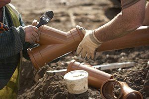 Plumber Fitting Drainpipe - Sparkman Plumbing - Lakeland, FL Plumber Fitting Drainpipe - Sparkman Plumbing - Lakeland, FL
