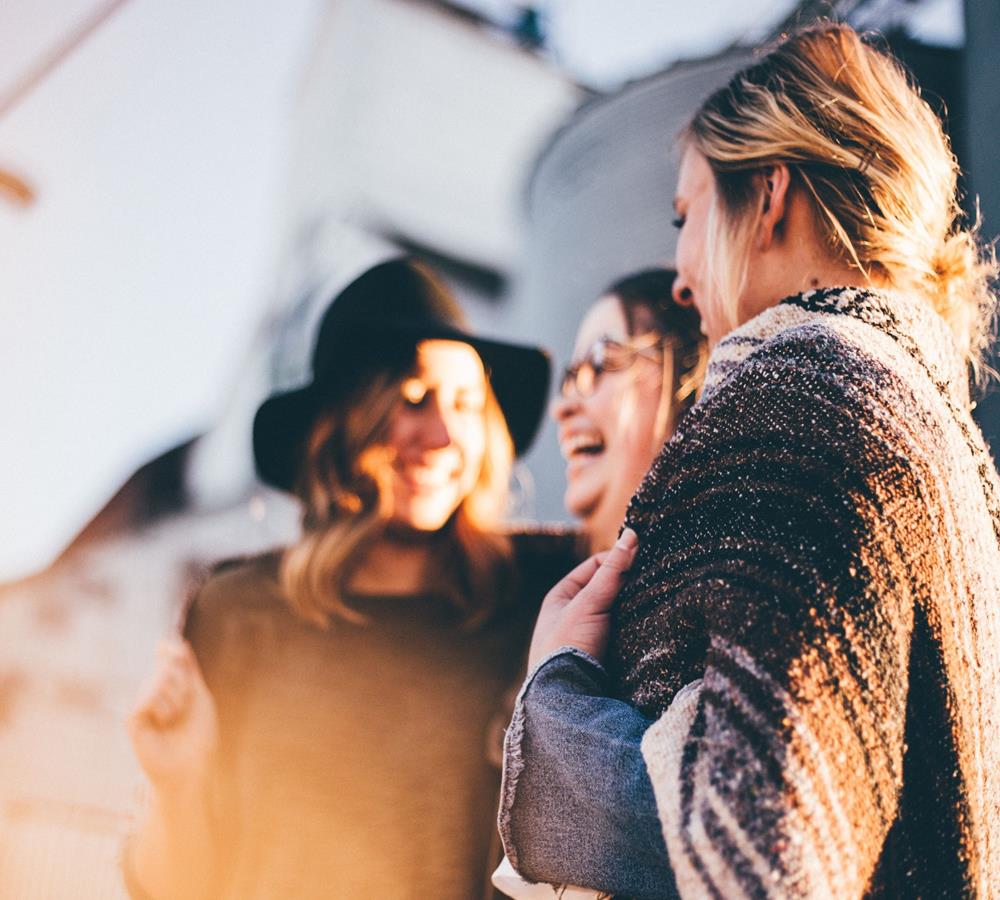 women talking and laughing