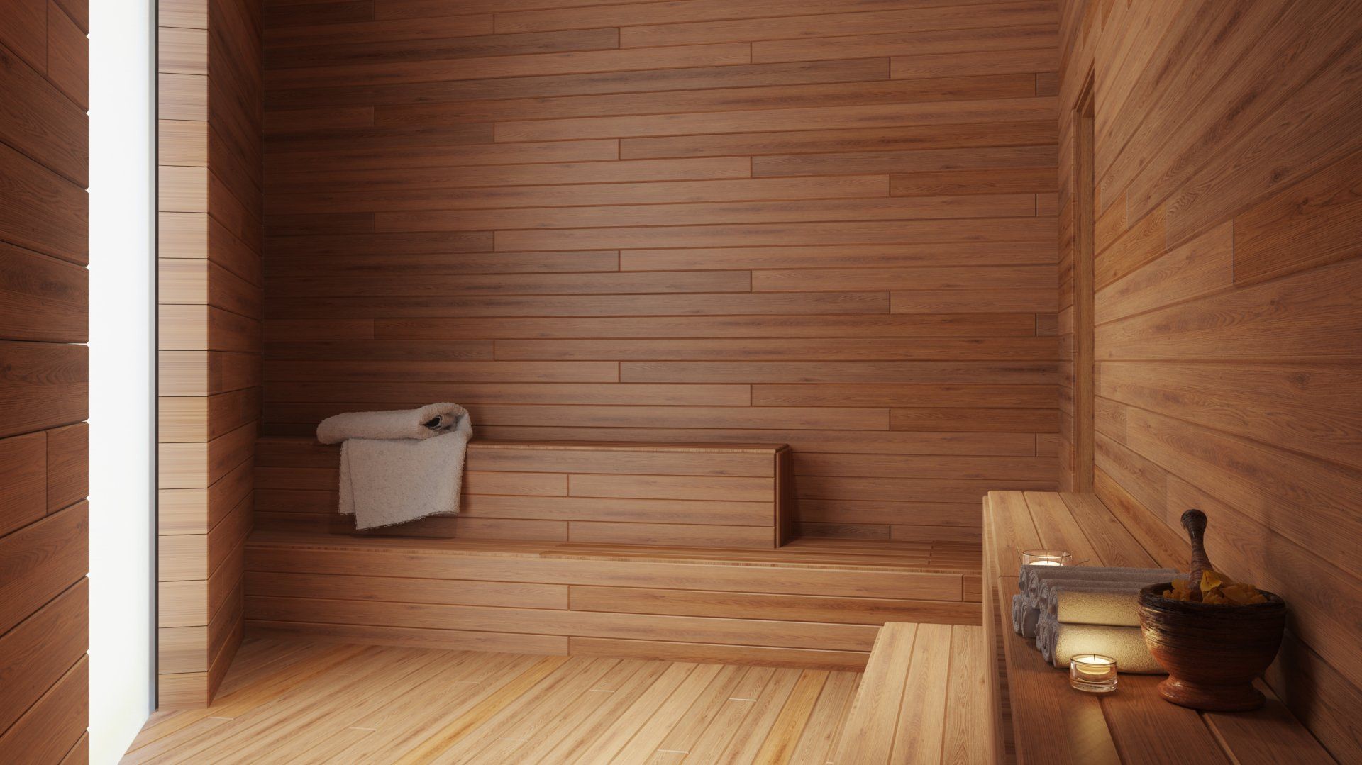 Una sauna de madera con ventana y toallas en los bancos.