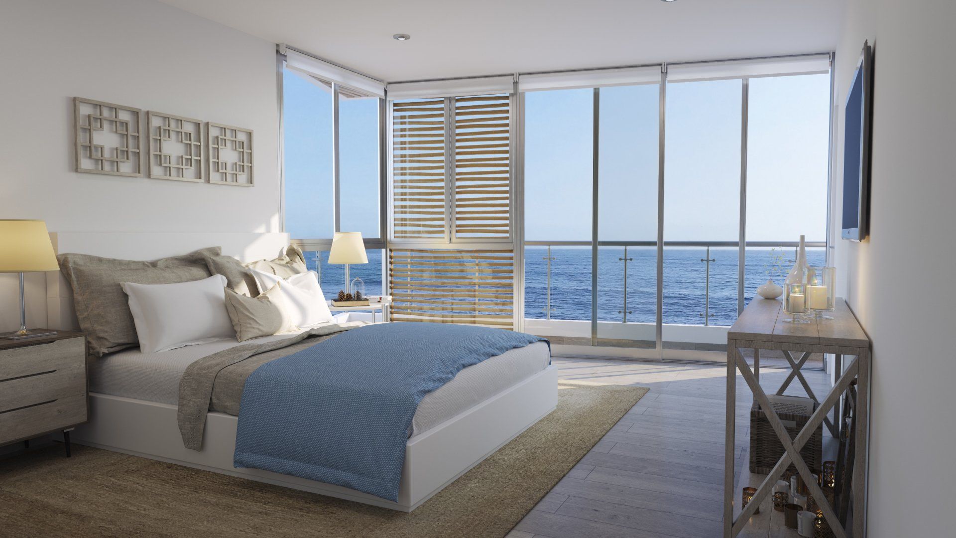 Un dormitorio con una cama grande y muchas ventanas con vista al océano.