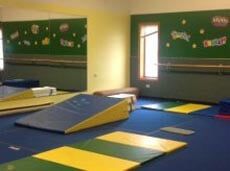 Gymnast Service — Gymnastic Room With Blue Mat in Greensburg, PA Gymnast Service — Gymnastic Room With Blue Mat in Greensburg, PA