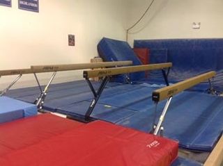 Gymnast Instructor Blue And Red Floor Mat in Greensburg, PA Gymnast Instructor Blue And Red Floor Mat in Greensburg, PA