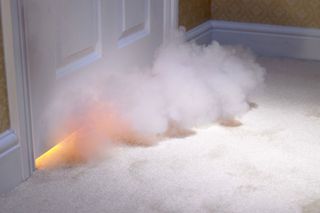 fire and smoke coming out of the room