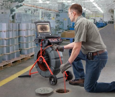 man using cctv camera to find leak