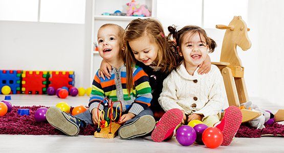 Child Development Center — Kids Playing in the Room in Atlanta, GA Child Development Center — Kids Playing in the Room in Atlanta, GA
