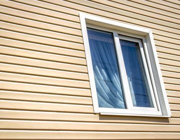 Siding — Wall Covered By Vinyl Siding in Victoria, TX