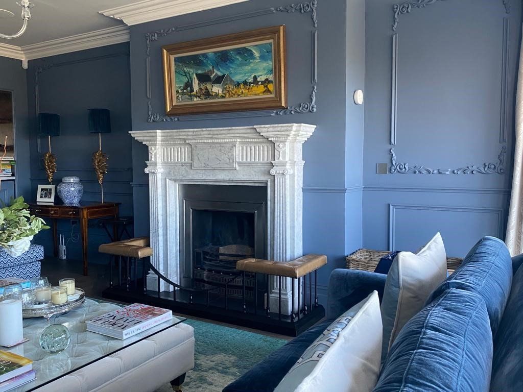 marble fireplace in a traditional living area