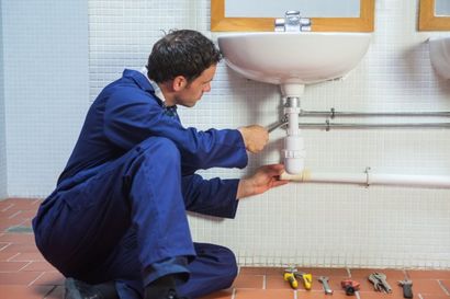 Plumber fixing a sink - Sir Fix It in Hampton, VA