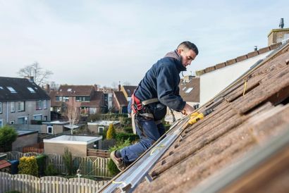 man repairing damaged roof materials - Sir Fix It in Hampton, VA