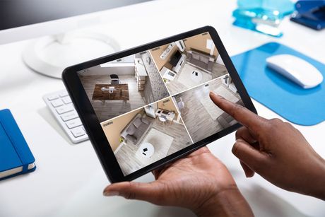 Monitoring CCTV Footage On Tablet — Chester, VA — Petersburg Alarm Company, Inc. Monitoring CCTV Footage On Tablet — Chester, VA — Petersburg Alarm Company, Inc.