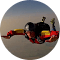 A toy train is flying through the air in a circle.