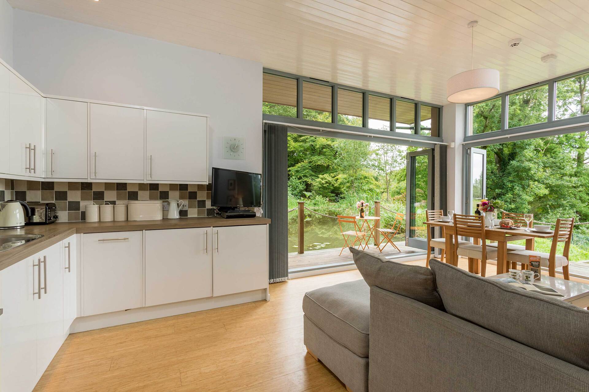 open plan lounge with stunning views to a lake