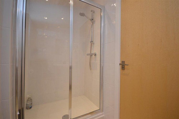 clean white batroom with shower