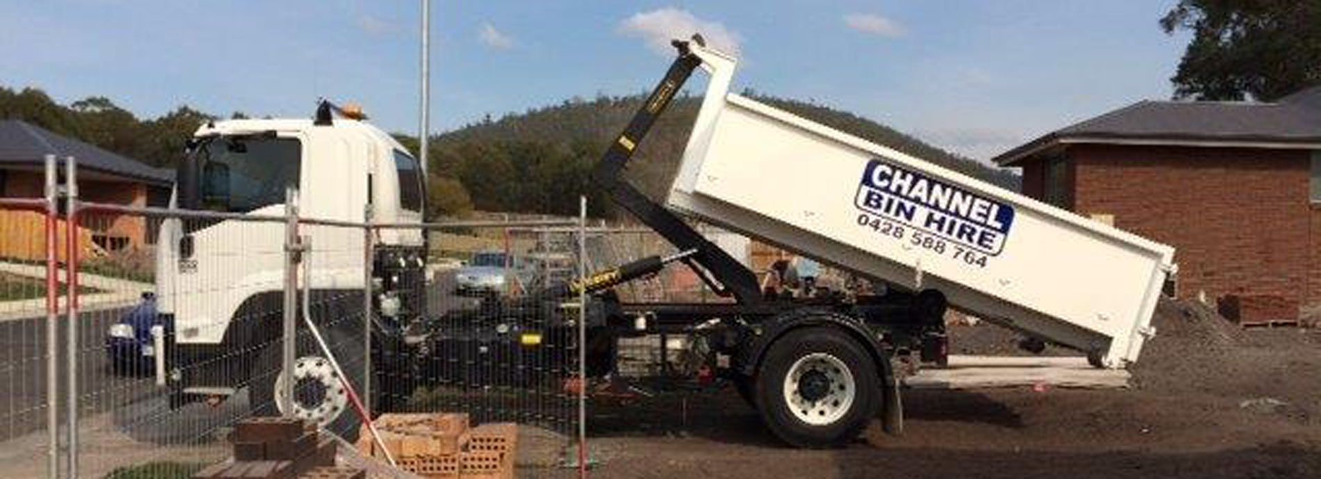 channel earthmoving truck pulling bin channel earthmoving truck with bin hire in Kingston