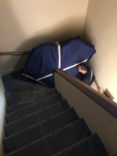 Covered Piano on the Stairs — St. Louis, MO — A Piano’s Friend
