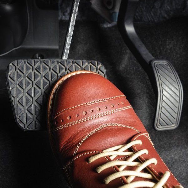 Foot Pressing the Brake Pedal of a Car — Brake & Clutch Repairs in New Lambton, NSW