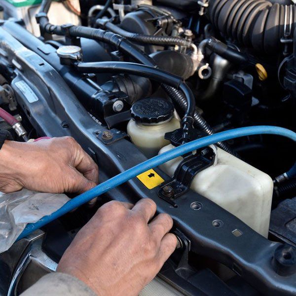 Refilling Coolant to Air Condition — Auto Repairs in New Lambton, NSW
