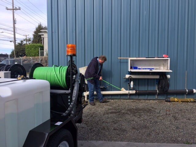 Plumber cleaning a clogged pipe - Clogged Drain in Swansboro, NC Plumber cleaning a clogged pipe - Clogged Drain in Swansboro, NC