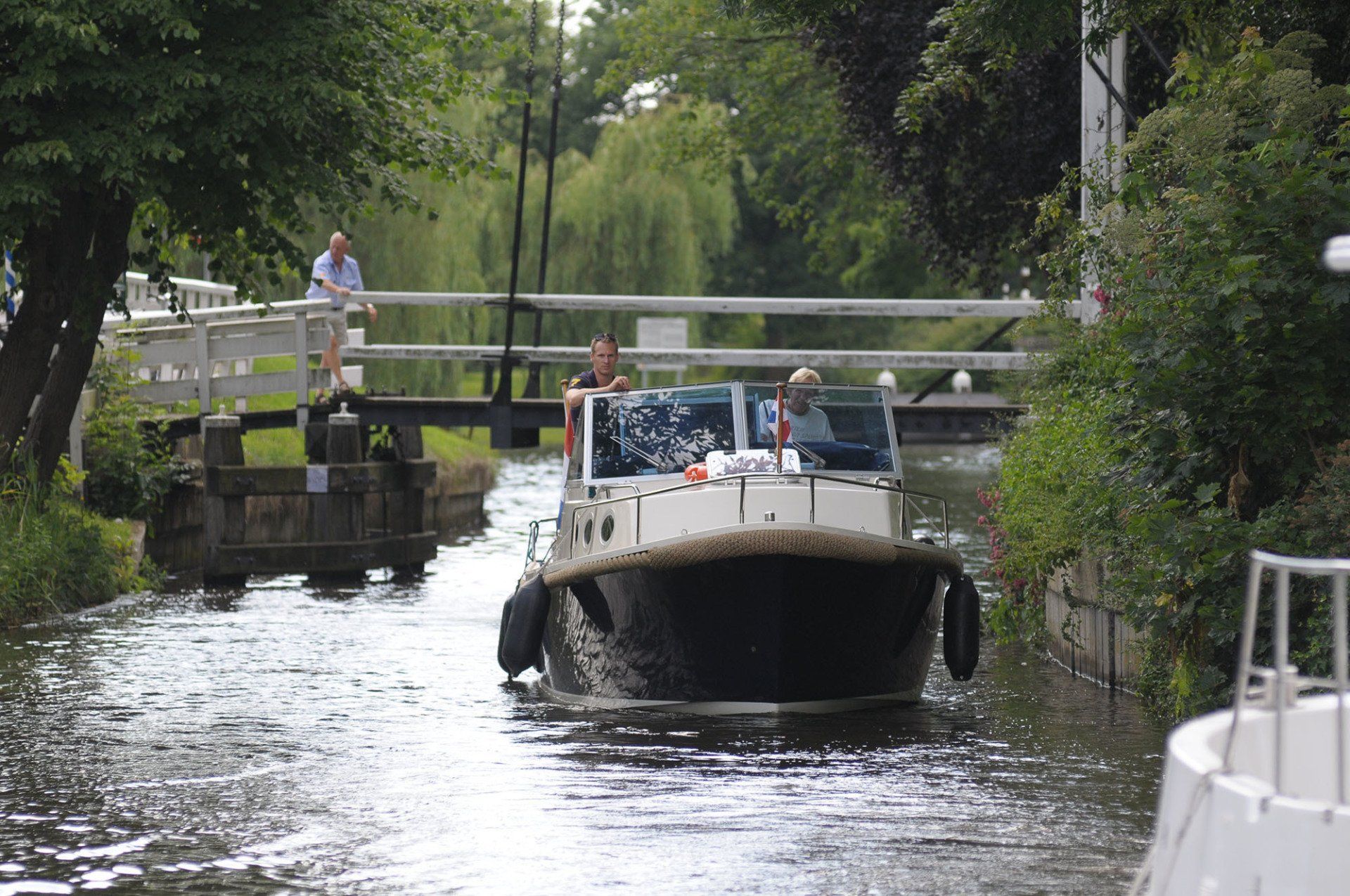 boat passing bridge