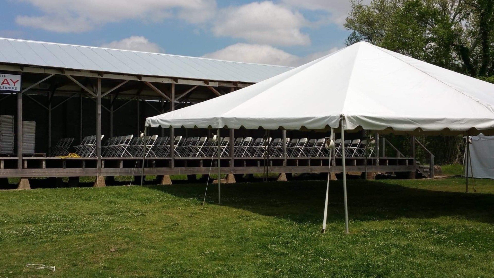 White Tent Beside The Chair Arrangements — Jackson, MS — All Seasons Events