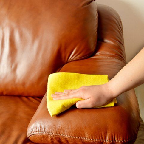 leather couch being cleaned