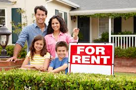 Family in front of their new rental home