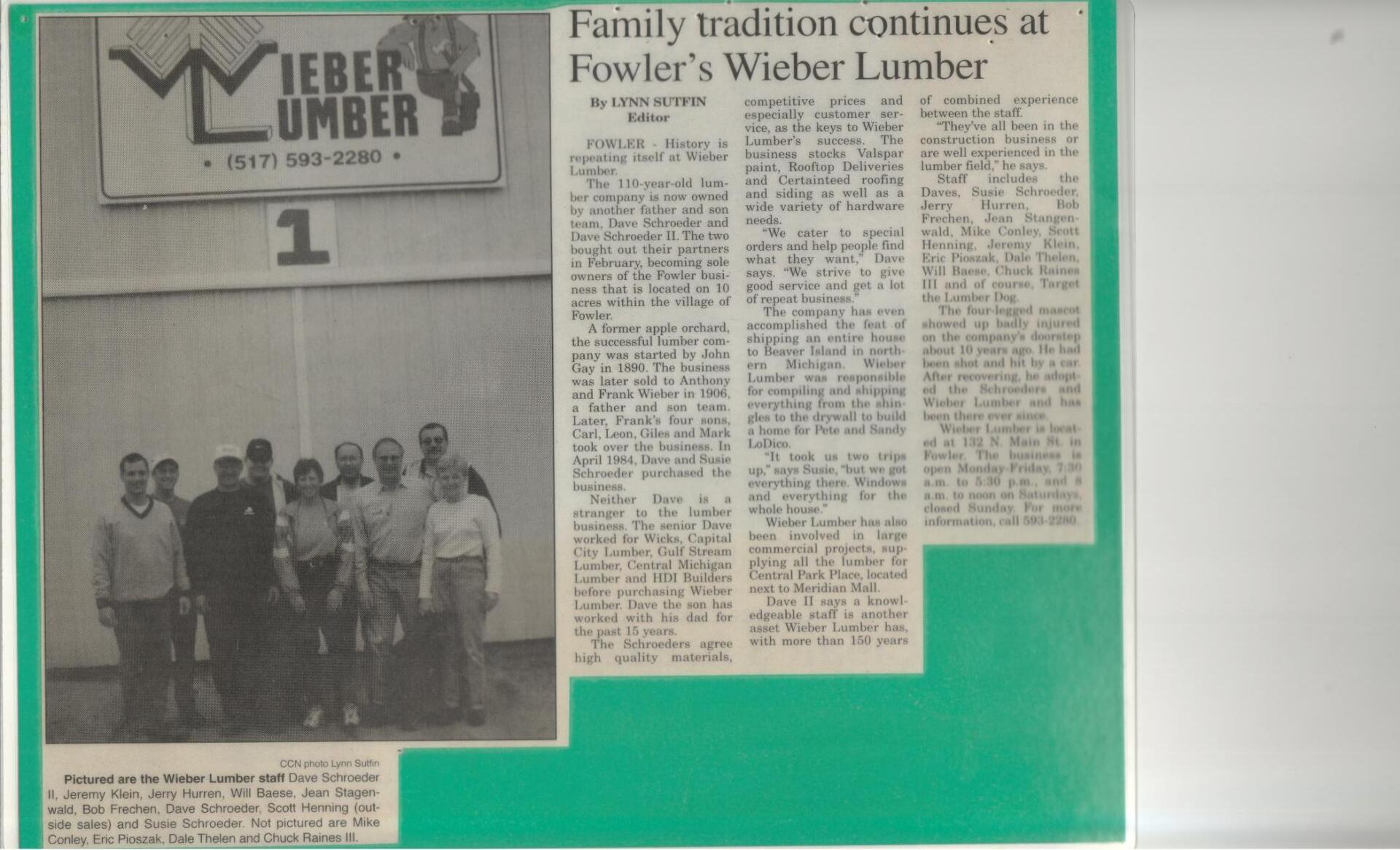 A newspaper clipping about Wieber Lumber featuring a black-and-white photo of a group standing in front of a lumber yard sign.