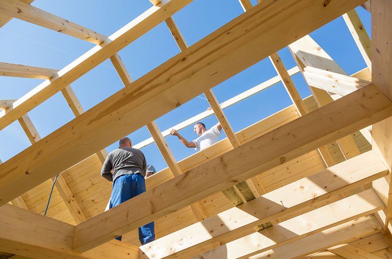 Wholesale Supply — Builders at Work with Wooden Roof Construction in Del City, OK