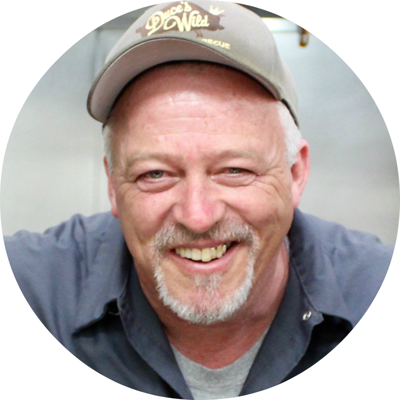A man wearing a hat that says ' donuts ' on it