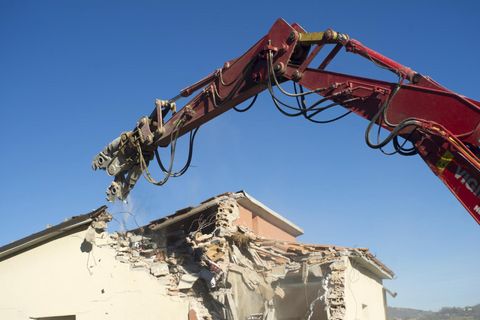 demolishing the concrete structure