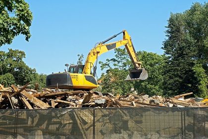 a yellow backhoe truck