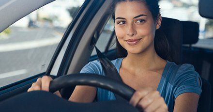 lady wearing seat belt and looking at the rear view mirror south coast driving school lady wearing seat belt and looking at the rear view mirror